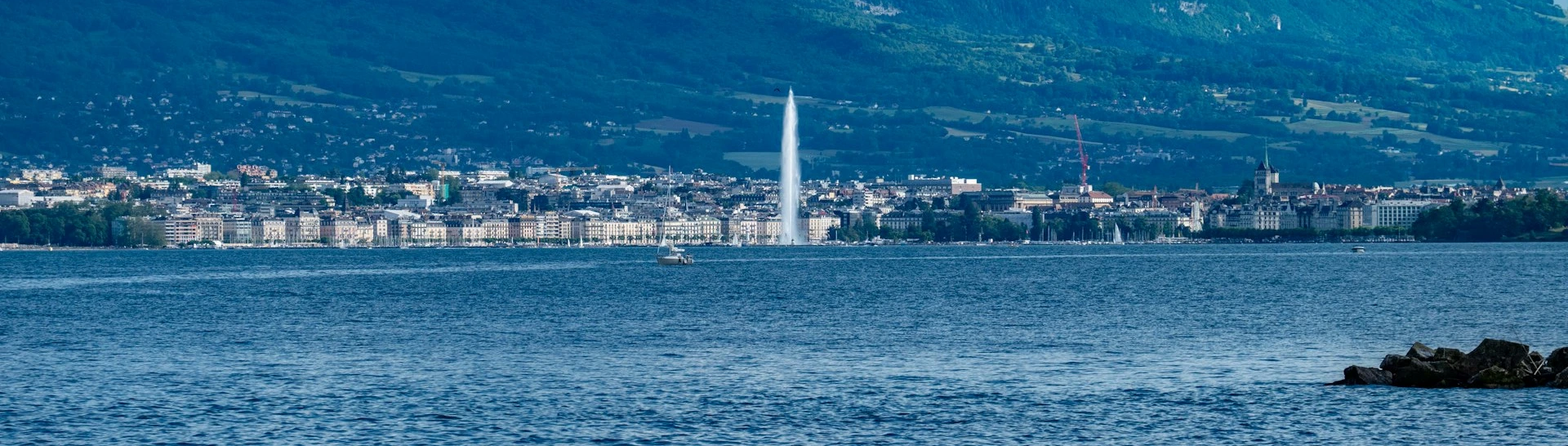 a large body of water with a city in the background